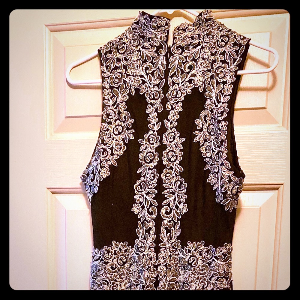 Sleeveless Black and Silver gown.
